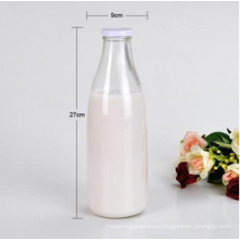 Empty 1000ml 1liter 1L glass milk bottle with white metal cap.